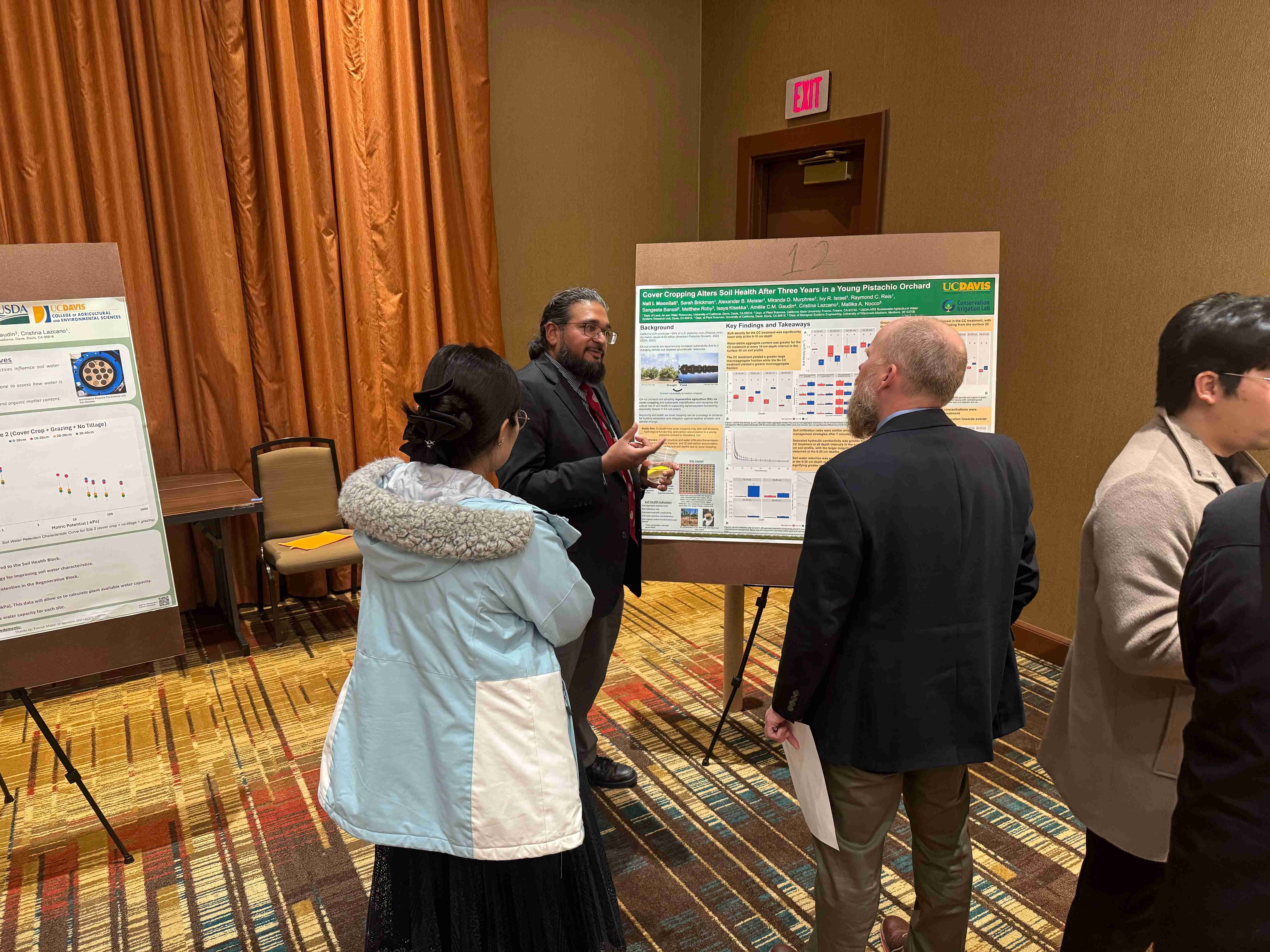 Nall Moonilall presenting his poster to an interested group
