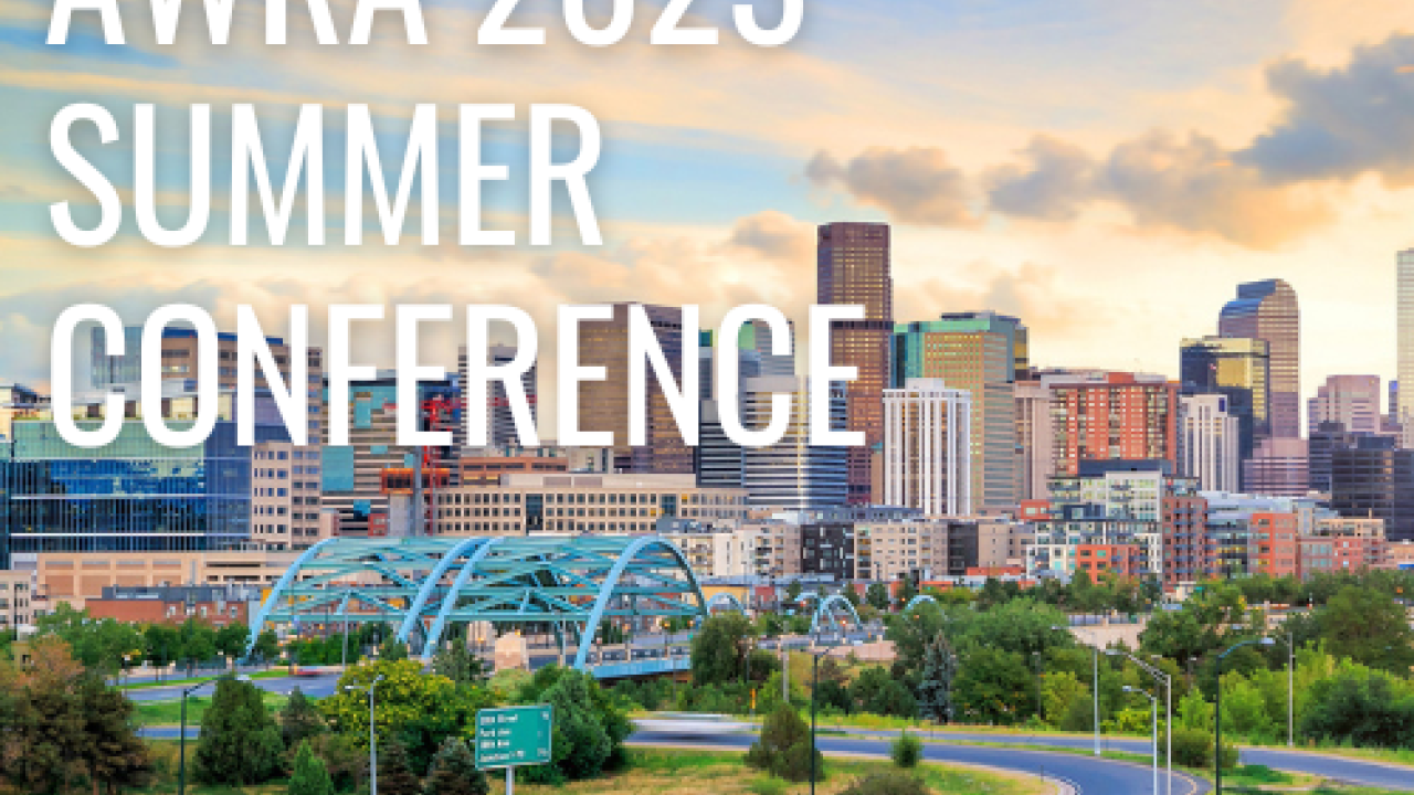 picture of the title of the event. there is a cityscape behind the image